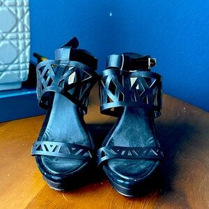 BCBGMaxAzria Leather Wedge with ankle strap and laser cut heels